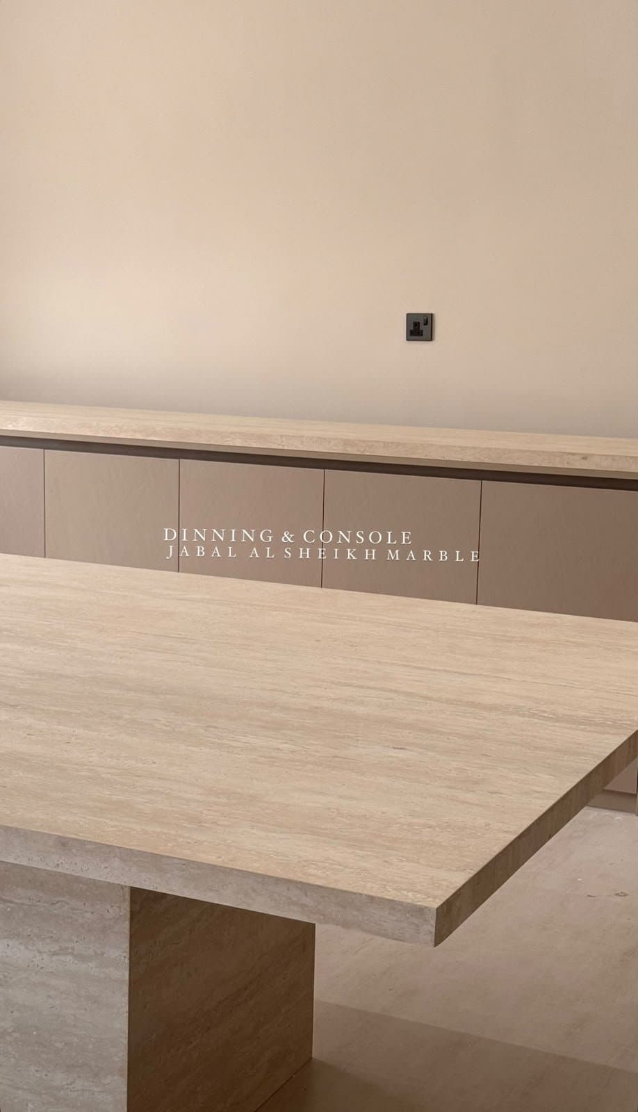 Travertine dining table and matching console along the wall