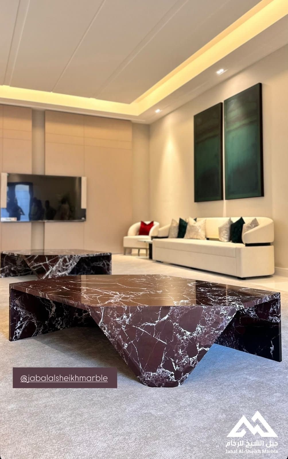 Burgundy marble coffee tables with dramatic white veining