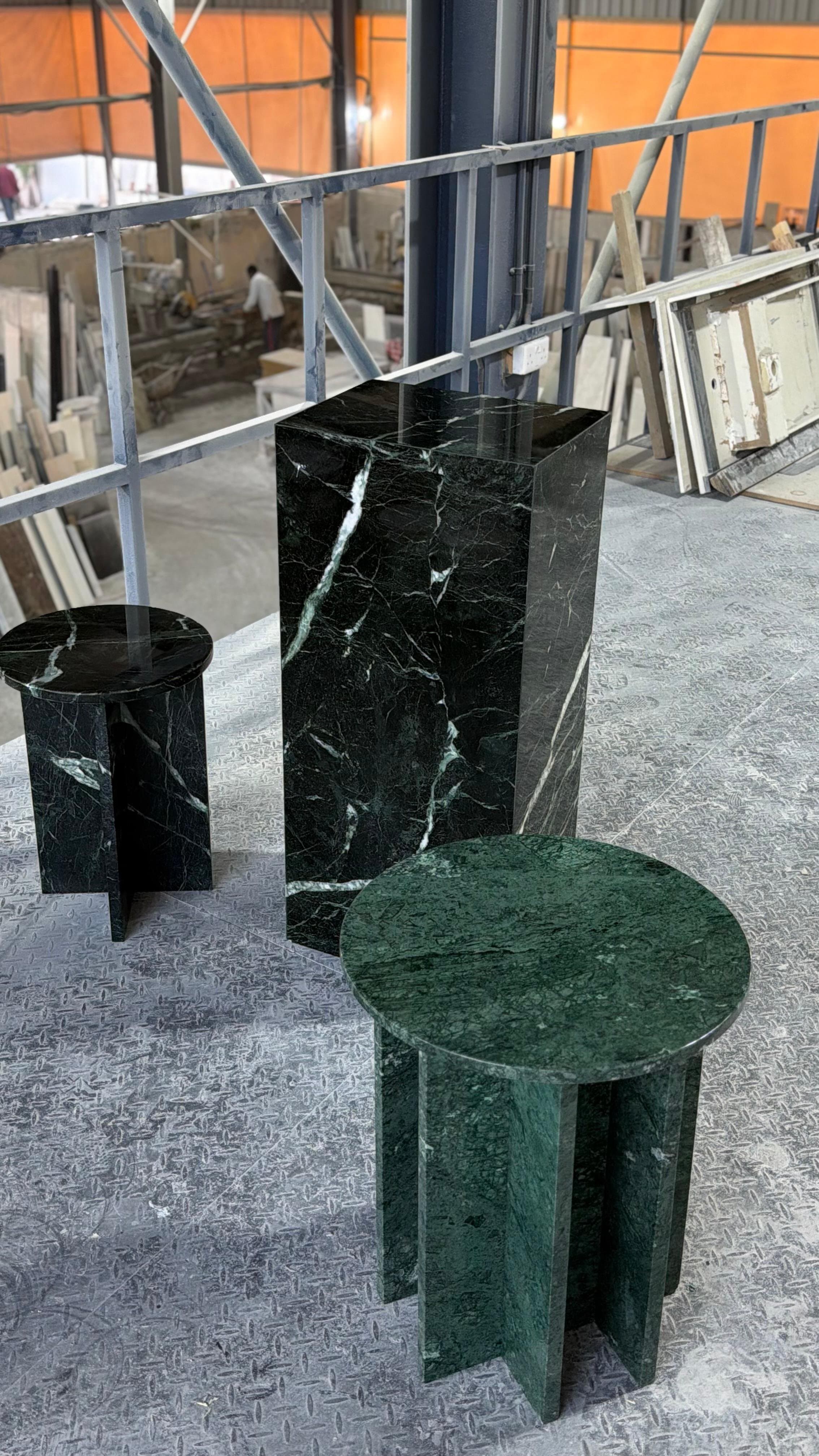 Set of green and black marble pedestal side tables