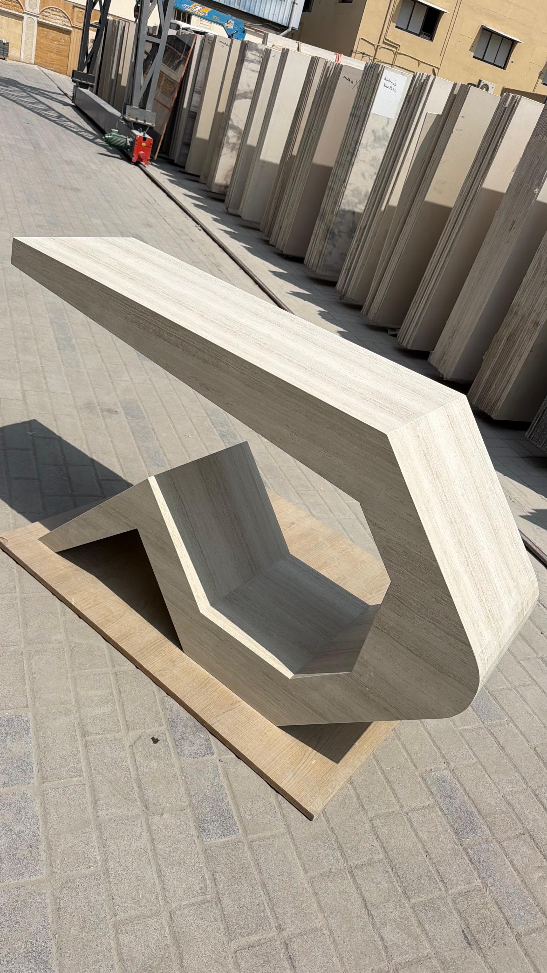 Sculptural angular bench with a geometric cut-out base