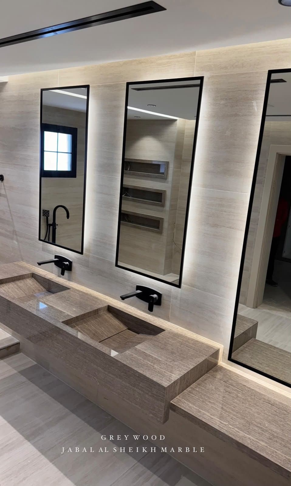 Greywood double vanity with backlit mirrors and floating stone counter
