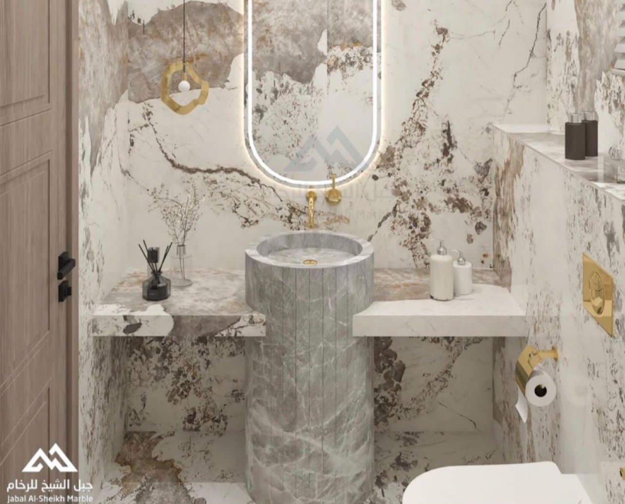 Dramatic beige and grey marble powder room with cylindrical pedestal sink